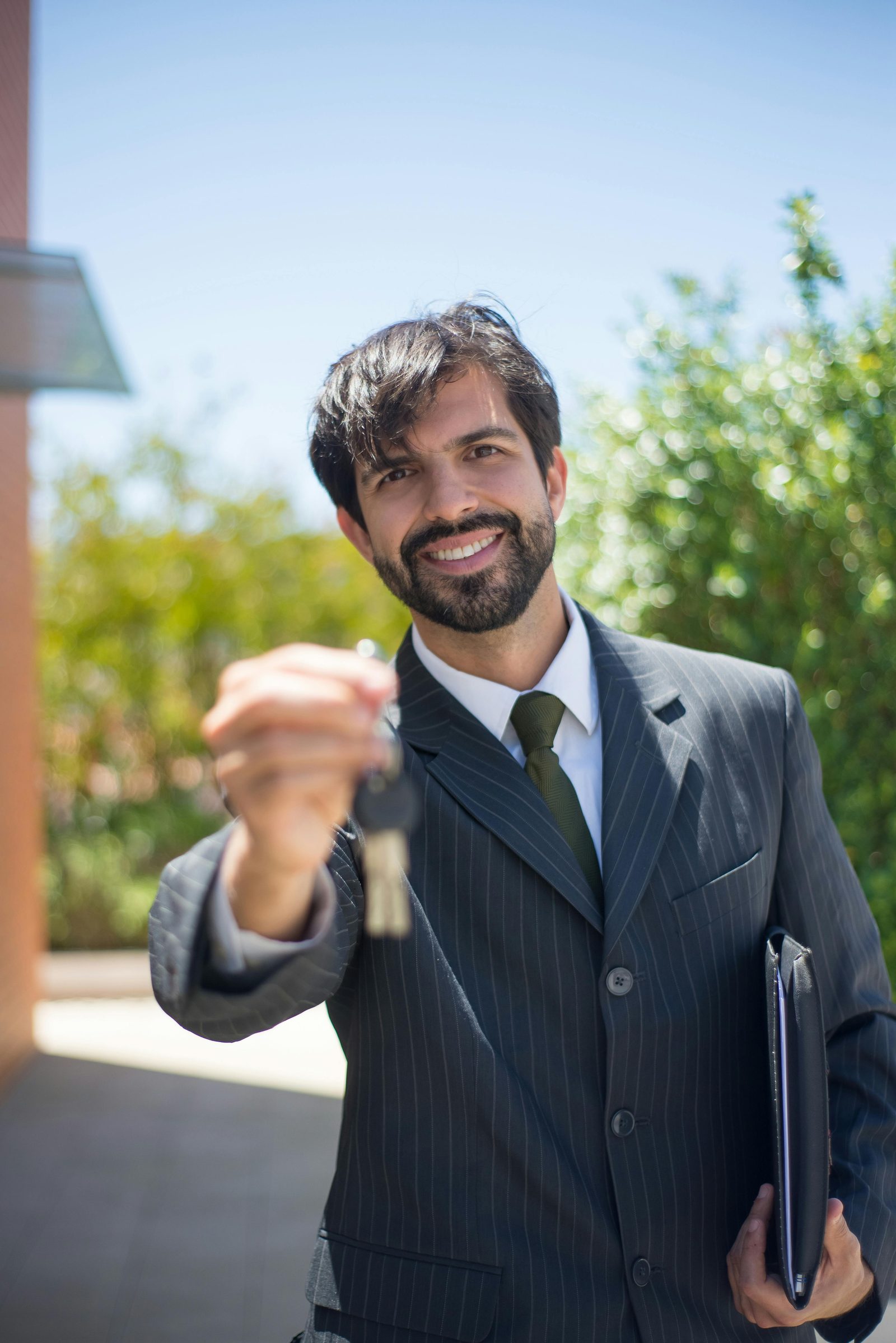 A real estate agent handing over apartment keys